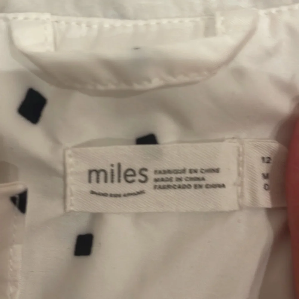 Miles Raincoat in white black and mustard yellow confetti pieces - Picture 3 of 5